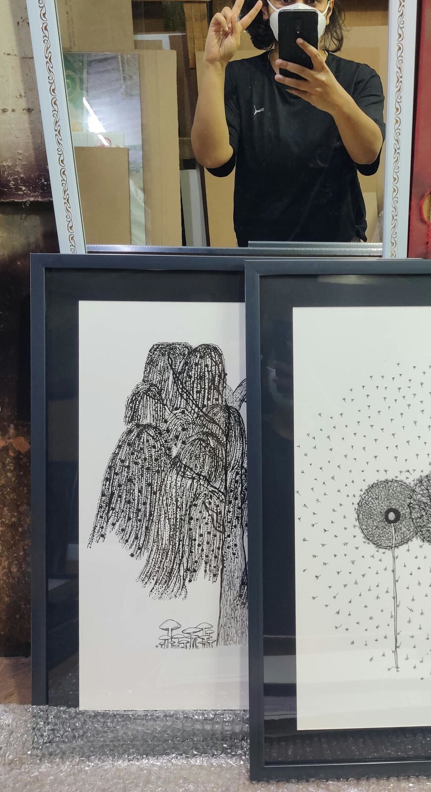 Saa's with her art, framed for the gallery